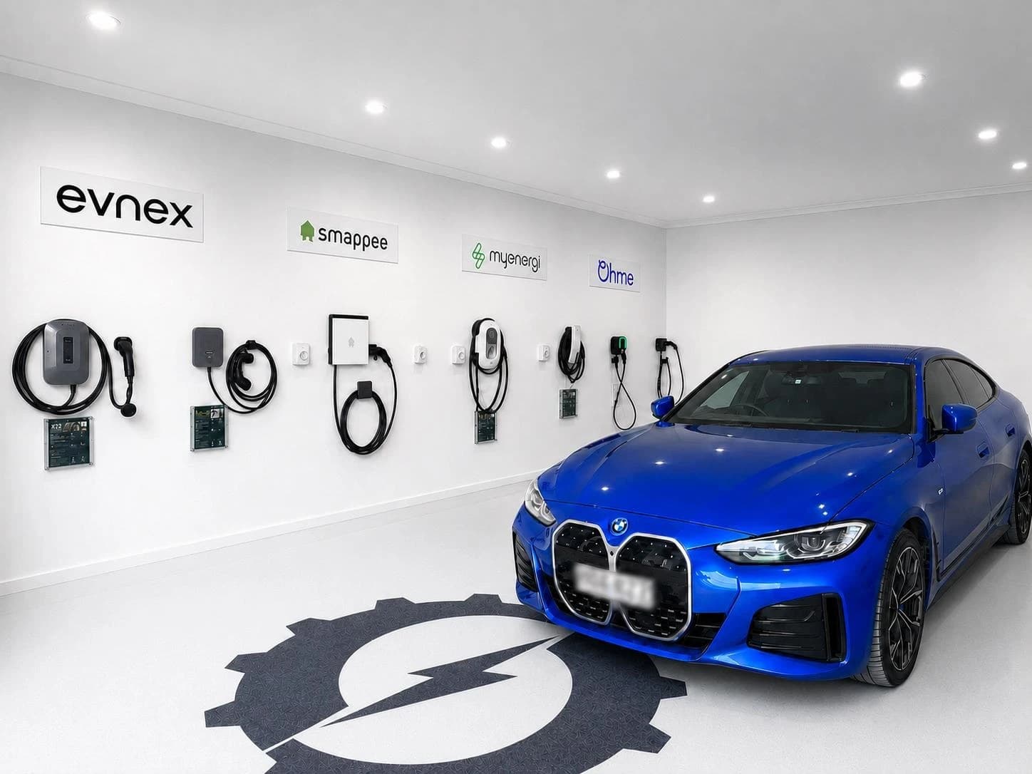 Wall-mounted EV charger showroom display with a BMW parked in front