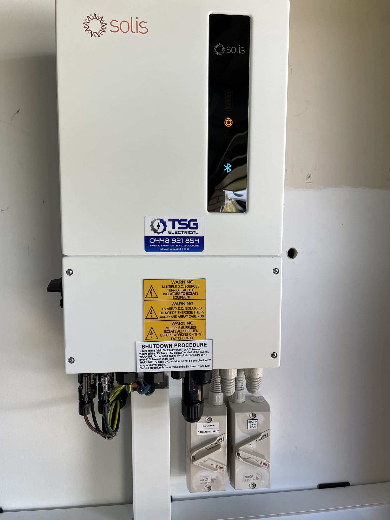 Solar inverter and switchboard installed with a TSG Electrical sticker