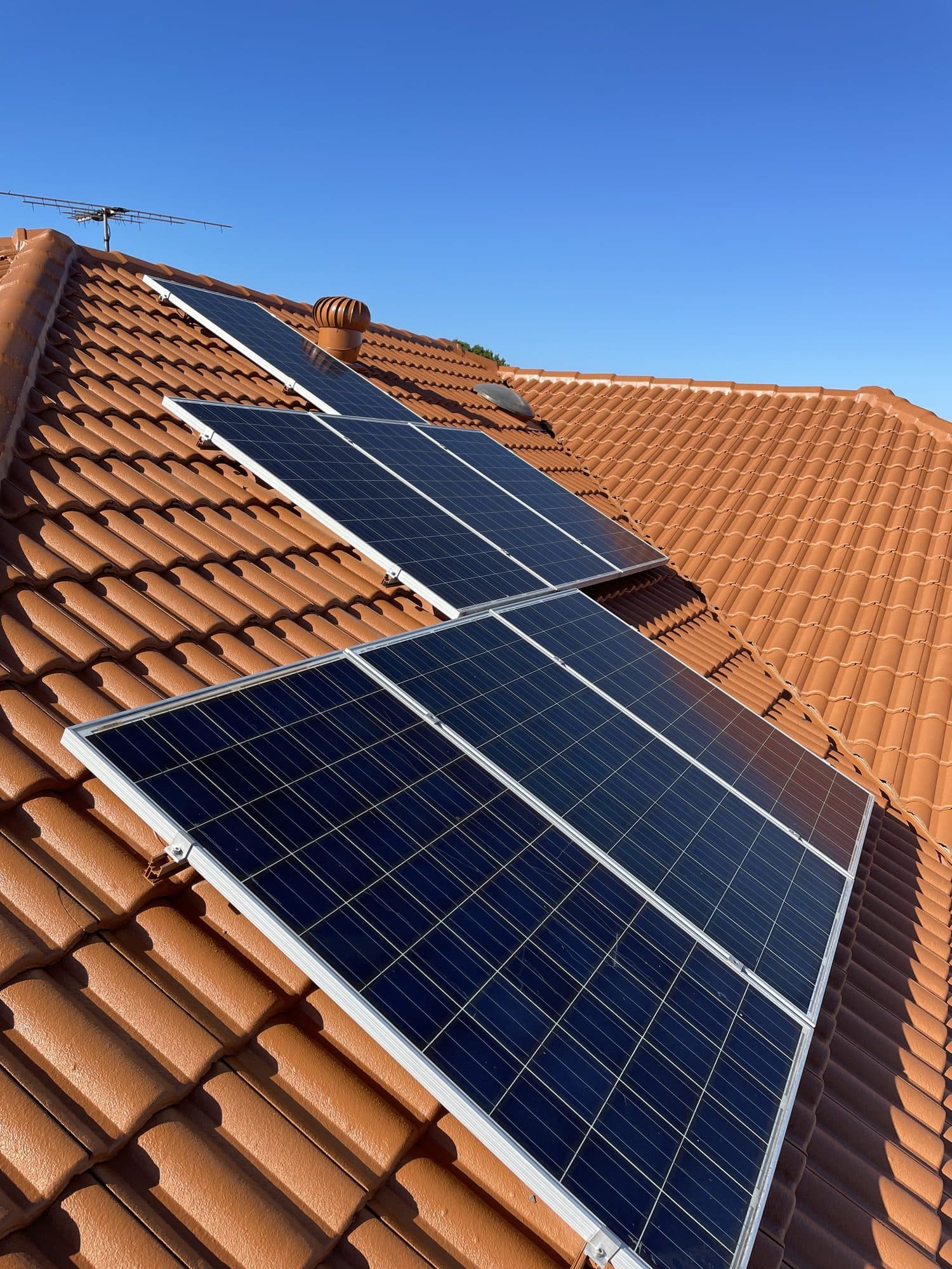 Solar panels installed on a residential tile roof by TSG Electrical